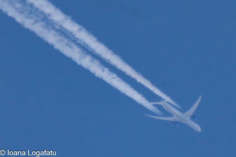 Contrails in a bright blue sky